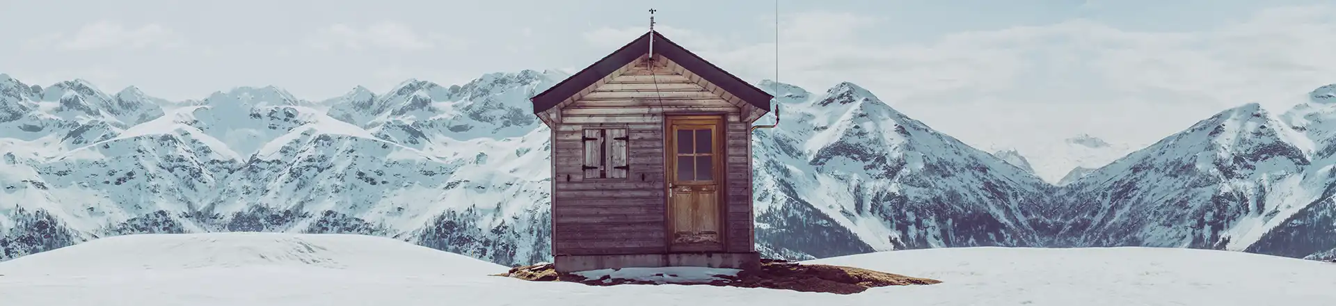 tiny home in snow covered mountains