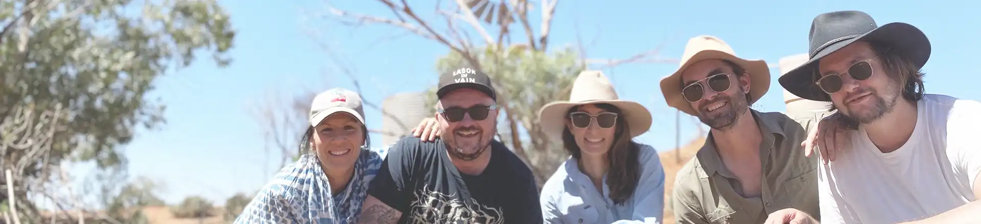 5 people wearing hats